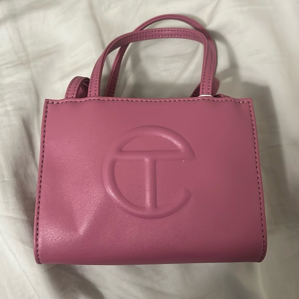 Mauve pink small telfar bag.